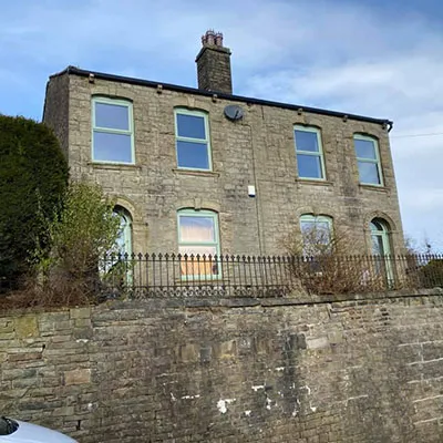 green windows in old cottage